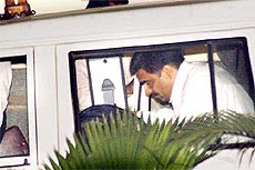 Deputy Commissioner of Police Pradeep Sawant in a police vehicle after he was arrested by SIT officials in connection with the Telgi stamp paper scam