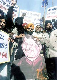 Activists of the National Akali Dal burning an effigy of Union Information and Broadcasting Minister Ravi Shankar Prasad during a demonstration against the Conditional Access System in the Capital