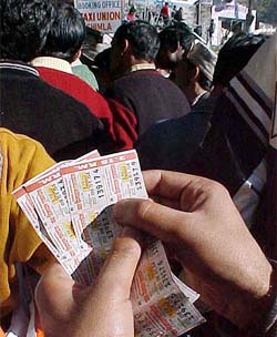 Brisk business as usual at a lottery stall at the Shimla bus stand