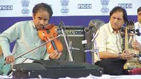 Dr L. Subramaniam (violin) and Ustad Sultan Khan (sarangi) perform during the inauguration of the second Pravasi Bharatiya Divas
