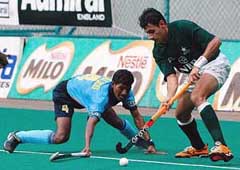 Pakistan�s Rehan Butt battles for the ball with India�s William Xalco