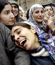 A Kashmiri woman cries at the funeral procession of Mohammad Shafi Bhat in Srinagar on Saturday.