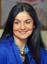 Bollywood actress-turned-director Pooja Bhatt smiles during a news conference to promote her new film Paap in New Delhi 