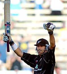 New Zealand skipper Stephen Fleming celebrates after completing his century during the third one-day international against Pakistan in Christchurch 