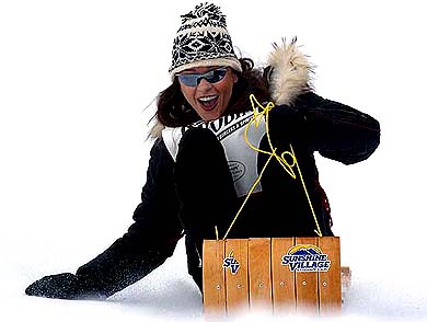 Hollywood actress Catherine Zeta-Jones lets out a scream as she toboggans down a hill at a ski resort in Banff, Canada, on Friday