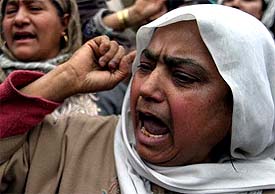 Women demonstrate against the alleged arrest of two youths in the Habbakadal area of Srinagar