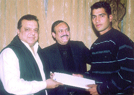 Chand Khanna Club secretary C K Khanna and president N. K. Bhatra felicitating Amit Bhandari for his selection to the Indian one-day team, presently playing in the triangular series in Australia
