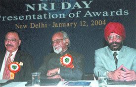 Owner of Inter Continental Lalit Suri, former Prime Minister I. K. Gujaral and NRI Institute secretary-general Jagmohan Singh at the NRI Day function
