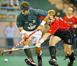 Pakistan�s Muhammad Saqlain is challenged by Germany�s Philipp Crone during Sultan Azlan Shah Cup hockey tournament in Kuala Lumpur