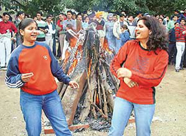 Students celebrate Lohri on the Panjab University campus in Chandigarh on Tuesday.