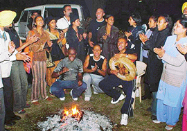 Members of Indigo Ocean, a Mauritian ballet company, celebrate Lohri with their Punjabi friends at the ICCR head office in Sector 35, Chandigarh, on Tuesday. 
