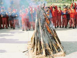 Students of Strawberry Fields School, Sector 24, celebrate Lohri in Chandigarh on Tuesday.