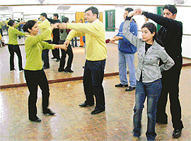 A salsa dance class in progress at Planet Fitness in Chandigarh.