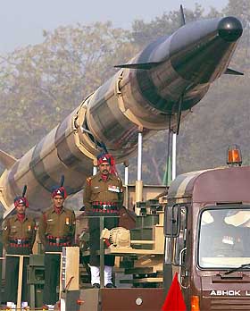Soldiers stand alongside the Agni-2 missile during an Army Day rehearsal in New Delhi 