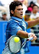 Australia's Mark Philippoussis plays a forehand to Ruben Ramirez Hidalgo of Spain