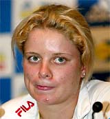 Belgium's Kim Clijsters talks to journalists at a news conference in Sydney 