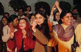Activist delegates of South Asia Partnership Pakistan Men and Women celebrate Lohri and express their happiness over the resumption of Samjhauta Express