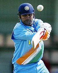 Virender Sehwag plays a square cut as he hits 90 runs in the one-day match against Zimbabwe in Hobart, Australia