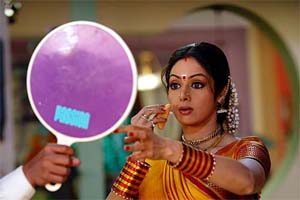 Bollywood star Sridevi checks her make-up during the making of a television serial, Malini Iyer, in Mumbai on Thursday