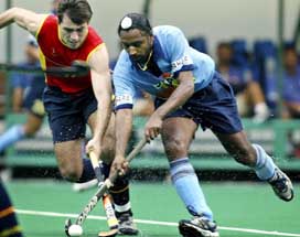 Baljeet Singh Dhillon is challenged by Spain's Albert Moreno during the 13th Sultan Azlan Shah Cup Hockey Tournament