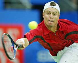 Lleyton Hewitt of Australia lunges for a return against Martin Verkerk of the Netherlands during the semi-final at the Sydney International tennis tournament