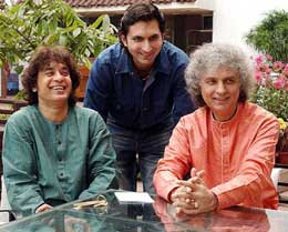 Tabla maestro Zakir Hussain, acclaimed santoor player Shiv Kumar Sharma and his son Rahul Sharma pose for a photograph in Kolkata 