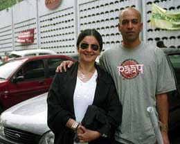 Bollywood actress-turned-director Puja Bhatt poses for a photograph with her husband Munish Makhiza in Kolkata 
