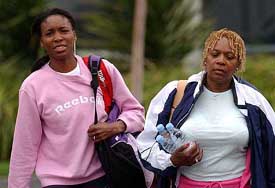 US tennis star Venus Williams walks with her mother Oracene Price after practice in Melbourne
