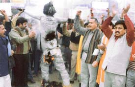 Activists of the Shiv Sena burn the effigy of the Hurriyat Conference, in Ludhiana