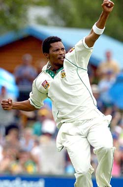 South African fast bowler Makhaya Ntini celebrates after taking the wicket of Ramnaresh Sarwan of West Indies