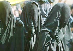 Iraqi women protest against the ban on Islamic headscarves in French state schools at a demonstration near the French Embassy in Baghdad 