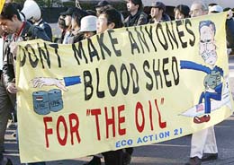 Japanese protesters hold a banner during an anti-war rally at Asaka, northwest of Tokyo, on Sunday