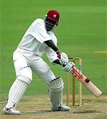 West Indies batsman Chris Gayle hits a four 