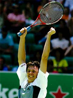 Sweden's Robin Soderling celebrates after defeating sixth seed Rainer Schuettler of Germany 