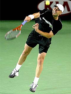 Fourth seed Andre Agassi of the US serves to Australia's Todd Larkham during their first round match at the Australian Open 