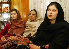 Saima Aadil, daughter of Nazeer Ahmad, chief engineer of Khan Research Laboratories, sits with her mother Tahira Nazeer and sister Sobia Ahmed in Islamabad