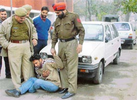 Dr Mehtab Singh, with a stolen car outside Sarabha Nagar police station, in Ludhiana