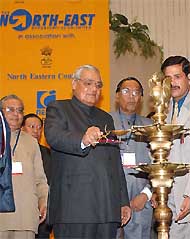Prime Minister Atal Bihari Vajpayee lights a traditional lamp to inaugurate the second North-East Business Summit,