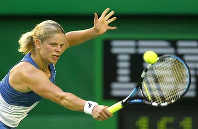 Belgium's Kim Clijsters plays a shot during her first round match against Germany's Marlene Weingartner