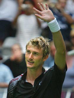 Juan Carlos Ferrero of Spain celebrates his 6-0, 6-1, 6-1 win over compatriot Albert Montanes