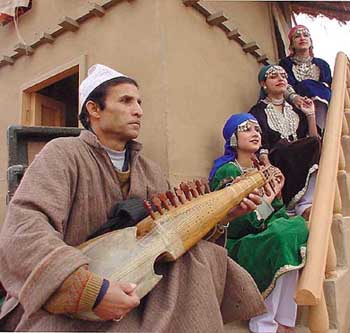 Traditional dancer from Jammu and Kashmir on the state tableau during the press preview of the forthcoming Republic day parade