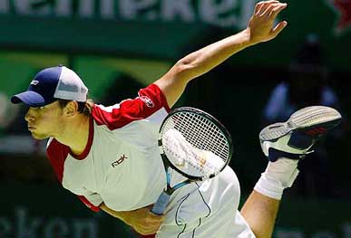 Andy Roddick of the USA serves during his match against Bohdan Ulihrach of the Czech Republic