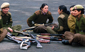 Female police officers take a break during a rehearsal for the Republic Day parade in Zeewan