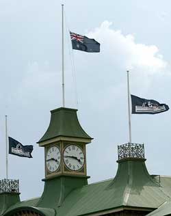 Flags fly at half-mast above the Sydney Cricket Ground in honour of former Test cricketer David Hookes 