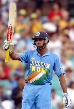 VVS Laxman acknowledges the crowd's applause after reaching his century
