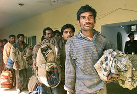 Detained Indian fishermen queue up inside a police station in Karachi on Thursday. 