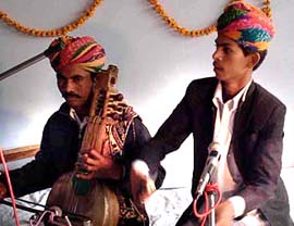 Folk artistes from Rajasthan perform at Manohar Memorial College in Fatehabad on Friday.