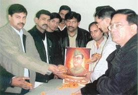 Activists of the All-India Anti-Terrorist Front offer floral tributes to Netaji Subhash Chander Bose