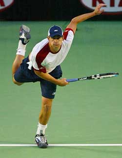Top seed Andy Roddick of the USA serves to compatriot Taylor Dent during his 6-2, 6-0, 6-2 win in the third round match at the Australian Open in Melbourne