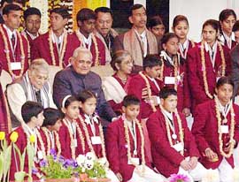 Prime Minister Atal Bihari Vajpayee and HRD Minister Murli Manohar Joshi pose with the recipients of National Bravery Award